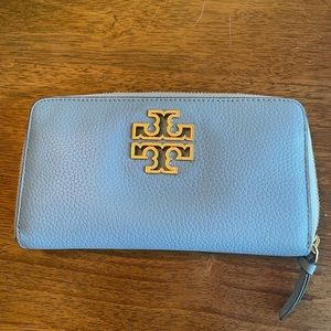 Powder blue Tory Burch wallet with gold accent.